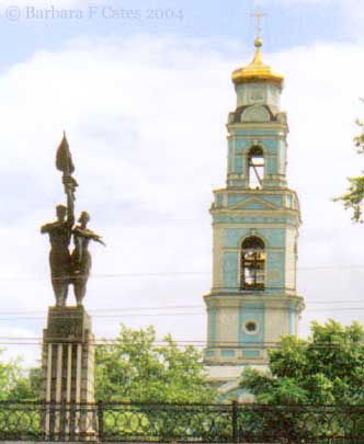 Kosomol Monument  with Old Ascension Church behind it